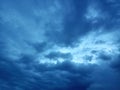 A view of dark blue sky with deep blue clouds