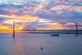 View of 25 de Abril Bridge over Tagus river on sunset. Lisbon, Portugal Royalty Free Stock Photo