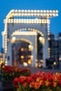 View of \'De Magere Brug\' (translation: the Skinny Bridge) in Amsterdam with tulips, the Netherlands Royalty Free Stock Photo