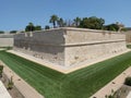 View of De Redin Bastion surrounded by a high wall, a part of the fortifications of Mdina, Malta Royalty Free Stock Photo