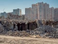 Deconstruction of building in front of new buildings