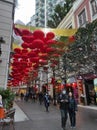 View of decorative lanterns hanging between buildings welcoming Chinese New Year on Lee Tung Avenue, Wan Chai, Hong Kong.