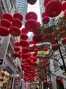 View of decorative lanterns hanging between buildings welcoming Chinese New Year on Lee Tung Avenue, Wan Chai, Hong Kong.