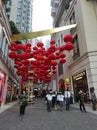 View of decorative lanterns hanging between buildings welcoming Chinese New Year on Lee Tung Avenue, Wan Chai, Hong Kong.