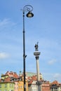 View of the decorative street lamp and column of the king Sigismund III. Warsaw, Poland