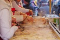 View of deep fried Reibekuchen, Kartoffelpuffer, at front of stall at Christmas Market. Royalty Free Stock Photo