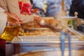 View of deep fried Reibekuchen, Kartoffelpuffer, at front of stall at Christmas Market. Royalty Free Stock Photo