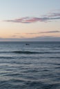 boat in the sea in late afternoon