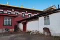 View of a deer against a traditional tibetan buddhist temple in Tibet