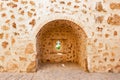 View of defensive embrasures in the walls of Niebla castle, in Huelva, Andalucia, Spain