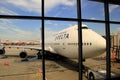 View of Delta aircraft through window at airport