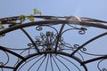 UPWARD VIEW OF METAL DOME AGAINST THE SKY WITH ROSE CREEPER Royalty Free Stock Photo