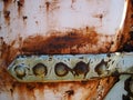 DETAIL ON METAL LATCH WITH RUST AND FLAKING PAINT ATTACHED TO METAL SURFACE Royalty Free Stock Photo