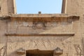 Detail of upper side of main entrance to temple of Horus at Edfu - Egypt Royalty Free Stock Photo