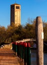 View of the Devil`s Bridge and the bell tower on the island of Torcello Royalty Free Stock Photo