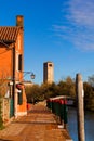 View of the Devil`s Bridge and the bell tower on the island of Torcello Royalty Free Stock Photo