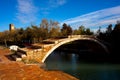 View of the Devil`s Bridge and the bell tower on the island of Torcello Royalty Free Stock Photo