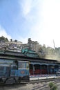 View of diesel locomotive and houses built on the hillside, along the Darjeeling Himalayan Railway, West Bengal, India