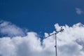 View of a digital TV antenna in the background of the cloudy sky