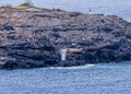 View from a distance of the Nakalele Blowhole on the Island of Maui.