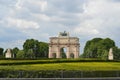 View from distance to Arc de Triomphe du Carrousel in Paris, France Royalty Free Stock Photo