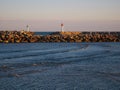 View in the distance of two lighthouses on the coast during a sunset Royalty Free Stock Photo