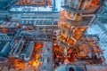 View of the distillation column at the oil refinery at dusk