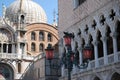 The view of Doge`s Palace & St Mark`s Basilica, Venice, Italy with a decorative lamp post in the foreground.