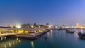 View of the Doha city in front of the Museum of Islamic Art day to night timelapse in the Qatari capital, Doha. Royalty Free Stock Photo