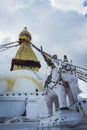 The dome of the Boudhanath Stupa with statues and prayer flags, Kathmandu, Nepal Royalty Free Stock Photo