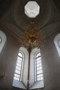 view of the dome and chandelier in the temple Tikhvin Monastery of the Dormition of the Mother of God, Russia, Chuvash Republic