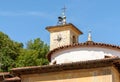 View of the Dome with old clock of the deconsecrated Church of S. Carlo in ancient village Castello Cabiaglio, Italy Royalty Free Stock Photo