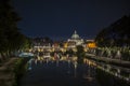 View of the dome of Saint Peter at night together with the Tiber river Royalty Free Stock Photo