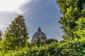 View of the dome of Saint Peter`s Basilica in Rome seen from a garden Royalty Free Stock Photo