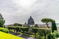 View of the dome of Saint Peter`s Basilica in Rome seen from a garden Royalty Free Stock Photo