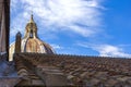 View at the dome of Saint Peter`s Basilica and tiled roof in Vatican City, Rome, Italy. Royalty Free Stock Photo