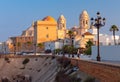 Cathedral of the Holy Cross on the Cadiz waterfront at dawn. Royalty Free Stock Photo