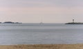 View from doran beach of a sailboat traveling into Bodega bay