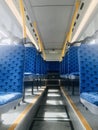 City bus empty blue seats. Royalty Free Stock Photo