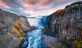 View from down of canyon of most powerful waterfall in Europe - Dettifoss. Splendid summer sunrise in Jokulsargljufur National Par