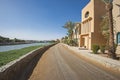 View down dirt road through landscaped tropical resort