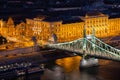 View down from Gellert Hill to the Freedom Bridge, University and Central Market Hall in Budapest, Hungary Royalty Free Stock Photo