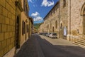 A view down a long quiet street in the city of Gubbio, Italy