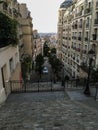 View down Montmartre staircase between apartment buildings in Paris, France