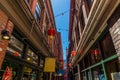 A view down a narrow shopping alleyway in Chinatown in Victoria British Colombia, Canada