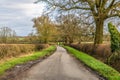 A view down a quiet country lane in the countryside close to Gumley in Leicestershire, UK