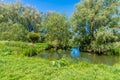 A view down the river Great Ouse in the Ouse Valley Park at Wolverton, UK