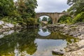 A view down the River Lune towards the Devils bridge and road bridge at Kirby Lonsdale, Cumbria, UK Royalty Free Stock Photo