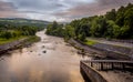 A view down the River Tummel at sunset from Pitlochry dam, on a cloudy evening Royalty Free Stock Photo