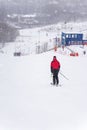 View down slope, skiing, skier back view. Winter sport Royalty Free Stock Photo